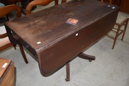 An early Victorian mahogany pedestal Pembroke table, having reeded edge detail and single frieze