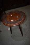 A 19th Century mahogany occasional table in the gypsy style having carved circular top on bobbin