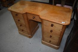 A Victorian deal kneehole desk or dressing table of small proportions, width approx. 109cm