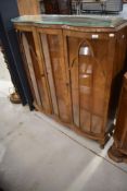An early 20th Century walnut china cabinet