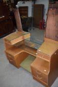 A vintage golden oak dressing table, labelled E Gomme, G Plan