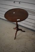A reproduction mahogany wine table