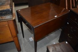 A Regency design mahogany pembroke style table habing frieze drawer and tapered legs