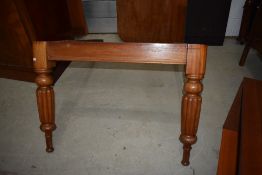 A Victorian mahogany dining table, as found