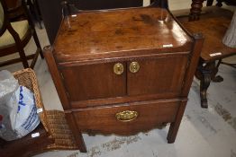 A Georgian mahogany cabinet, possibly converted step commode with two door cabinet over pull out