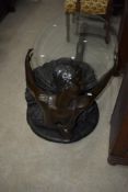 A modern bronze effect coffee table modelled as ballet dancer having oval glass top (being sold