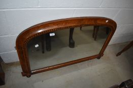 An Edwardian walnut overmantel mirror having inlaid decoration
