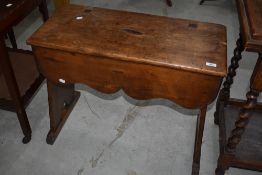 A stained pine bench seat in the Victorian Gothic style