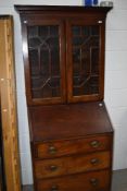 An early 20th Century Regency revival style bureau bookcase, with astral glazed section (glass af)