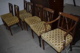 A set of seven (six plus one carver) Regency design mahogany dining chairs