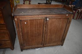 A late 19th or early 20th Century Scottish style dairy cupboard with ledge back and sides, width