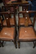 A set of four 1950s railback dining chairs