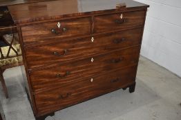 A 19th Century mahogany chest of two over three drawers having drop handles and bracket feet