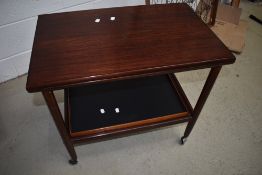 A vintage Rosewood tea trolley having fold over top CITES certficate 628511