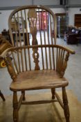 A 19th Century stripped Windsor style armchair