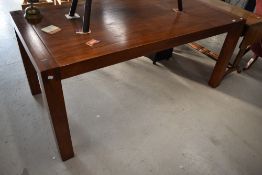 A modern stained frame dining table, approx 180 x 90cm