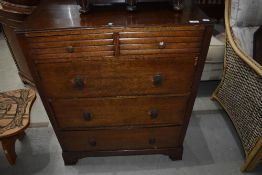 A vintage oak ply chest of two over three drawers