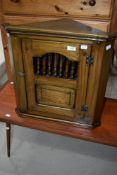 A modern Old Charm style small corner cupboard.