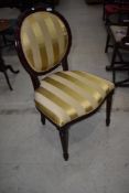 A reproduction regency upholstered dining chair