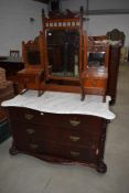 A Victorian mahogany two piece bedroom suite comprising dressing table with marble top and mirror