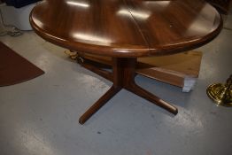 A vintage Danish Rosewood circular dining table , additional leaves still boxed, labelled BPS Mobler