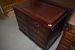 A reproduction Regency desk style four drawer filing cabinet with four faux drawers, width approx.