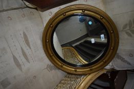 A vintage convex wall mirror, having circular gilt plaster frame, diameter approx. 46cm