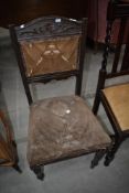 A Victorian dining chair having overstuffed back and seat
