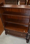 A stag minstral low bookshelf with drawer to base