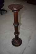 A reproduction stained frame torchere in the classical style, height approx. 98cm