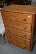 A modern Pine chest of five drawers, also having a fitted safe with key into one drawer.