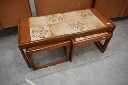 A nest of three 'Sunelm' tile-topped occasional tables, comprising large coffee table and two