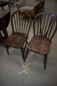 A pair of traditional hoop and stick back kitchen chairs