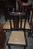 Three early to mid 20th Century oak rail back dining chairs