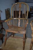 A 19th Century stripped Windsor style armchair
