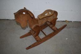 A vintage hand built wooden rocking horse