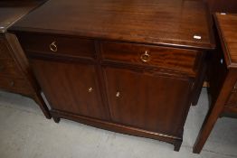 A Stag Minstral side cabinet with double drawer over cupboard
