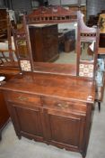 A Victorian mirror back sideboard having tiled and mirror back, width approx. 96cm