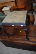 A Victorian rosewood dressing table stool having tapestry top and shaped legs