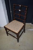 An interesting 19th Century salon or dining chair having turned mahogany frame