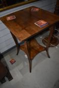 An early 20th Century mahogany occasional table having shaped legs and undertier, width approx.