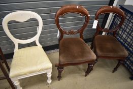 A pair of Victorian mahogany balloon back dining chairs and a similar painted chair