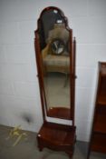 A reproduction Regency style cheval mirror frame (glass removed) having drawer base
