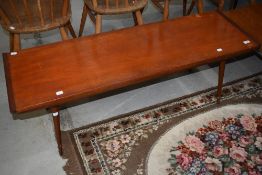 A mid century Teak coffee table on Dansette style legs, length approx. 120cm