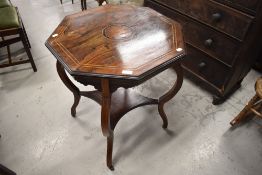 An Edwardian rosewood occasional table having line inlay decoration with octagonal top and shaped