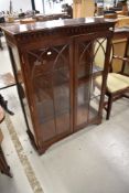 A reproduction mahogany display cabinet