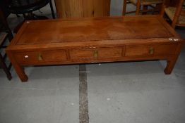 An Oriental hardwood coffee table having frieze drawers, approx. 153 x 56cm