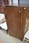 An early to mid 20th Century oak ply childrens wardobe