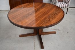 A modern/vintage Rosewood circular dining table with two additional leaves CITES Certificate 628858