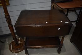 A dark stained Ercol tea trolley